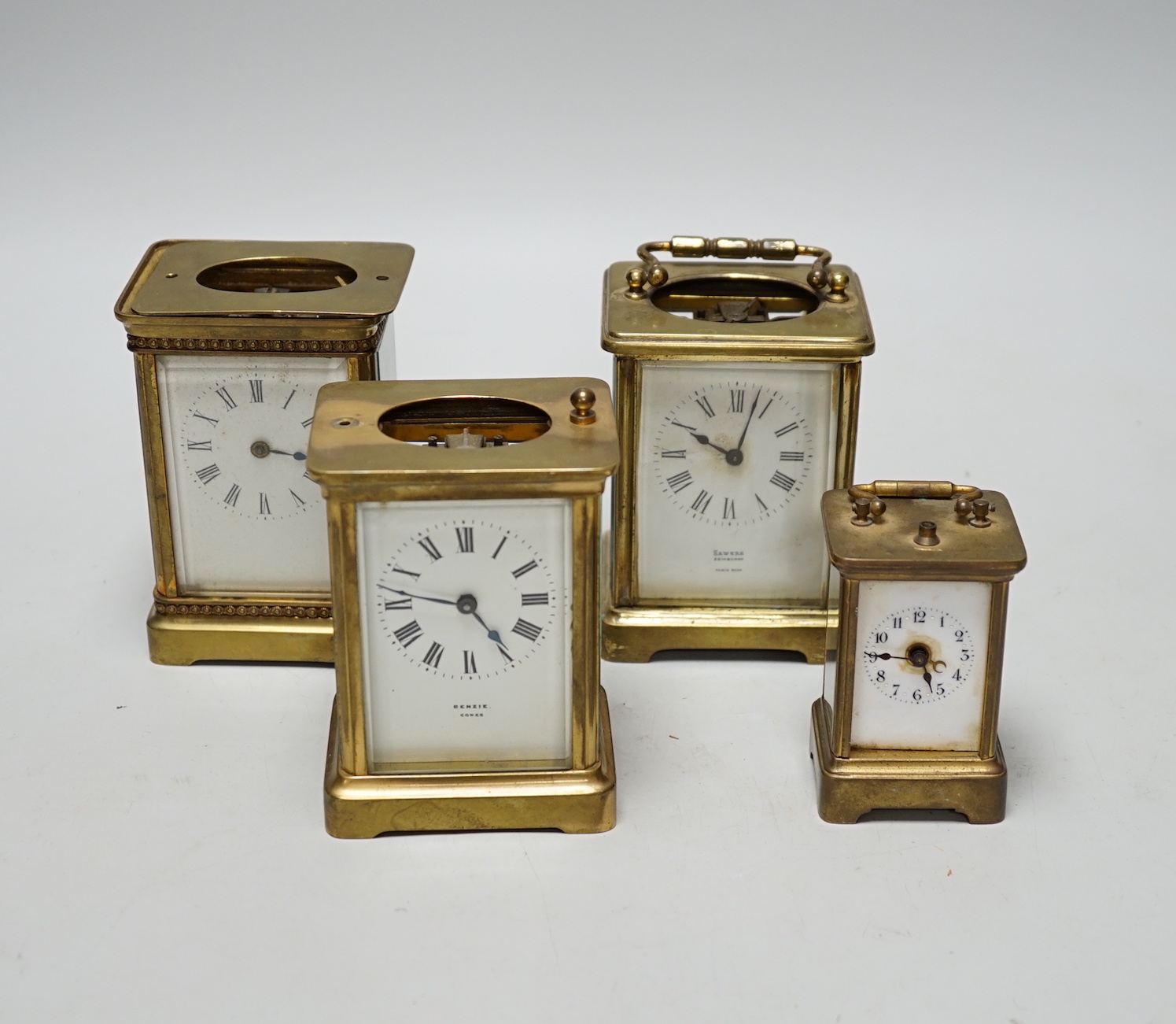 Four carriage clocks in varying sizes, tallest 12cm high